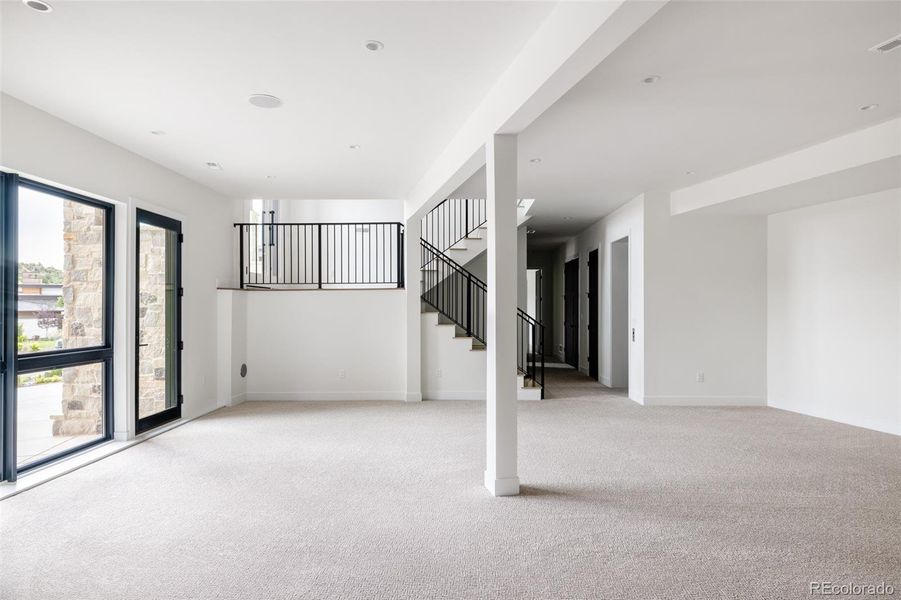 Door to driveway on the left, the stairway landing accommodates the front door entrance