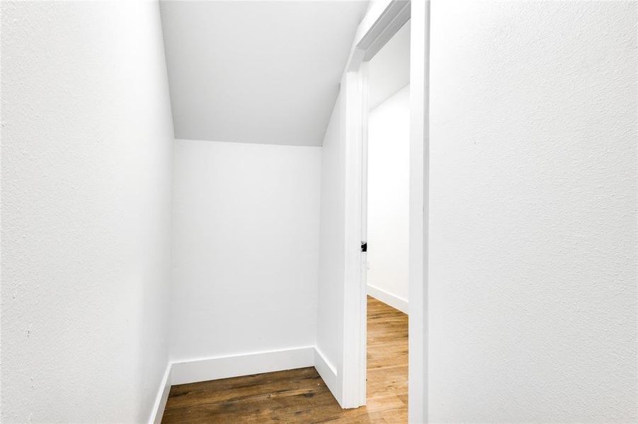 Corridor featuring hardwood / wood-style flooring