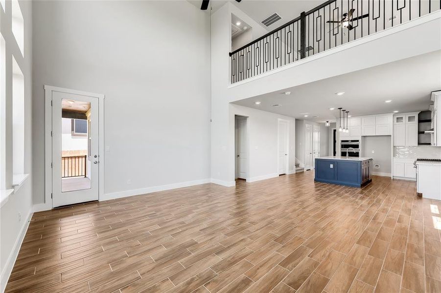 Tall, tall ceilings provide a birds eye opening from the large loft area.