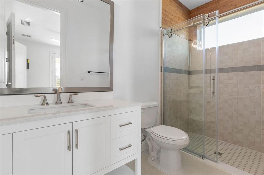 Ensuite features Beautiful shower with glass doors.