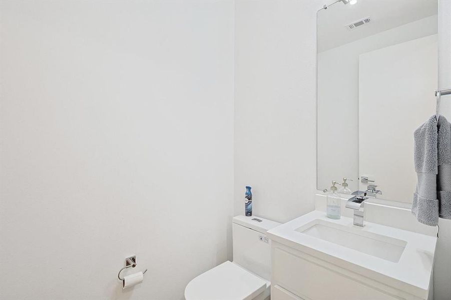 Bathroom featuring toilet and vanity