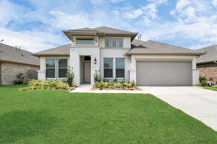 This home has charming curb appeal with a timeless brick elevation.