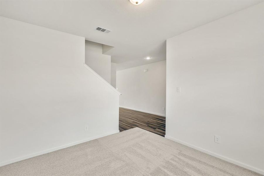 Unfurnished room featuring carpet flooring