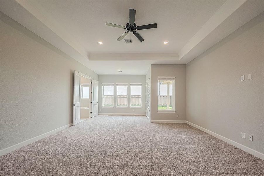 Primary Bedroom with Primary Sitting Area and door to Covered Porch