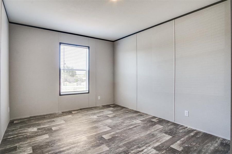 Unfurnished room with hardwood / wood-style floors