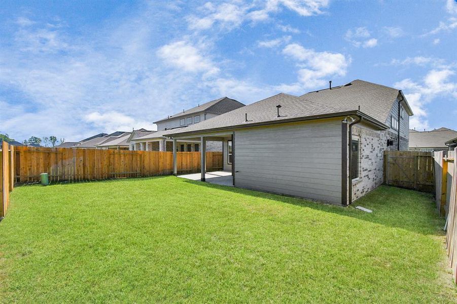 Backyard retreat, offering an abundance of space for kids to play and explore. The possibilities are endless in this outdoor haven, where the joy of open-air activities and family gatherings awaits.