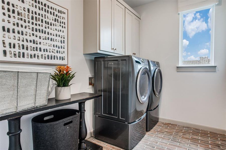 You'll be doing laundry in style in this beautiful laundry room!