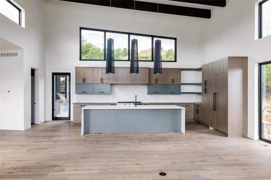 Door to patio with built-in outdoor kitchen