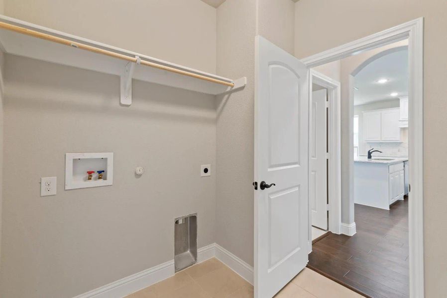 Laundry Room | Concept 3015 at Belle Meadows in Cleburne, TX by Landsea Homes