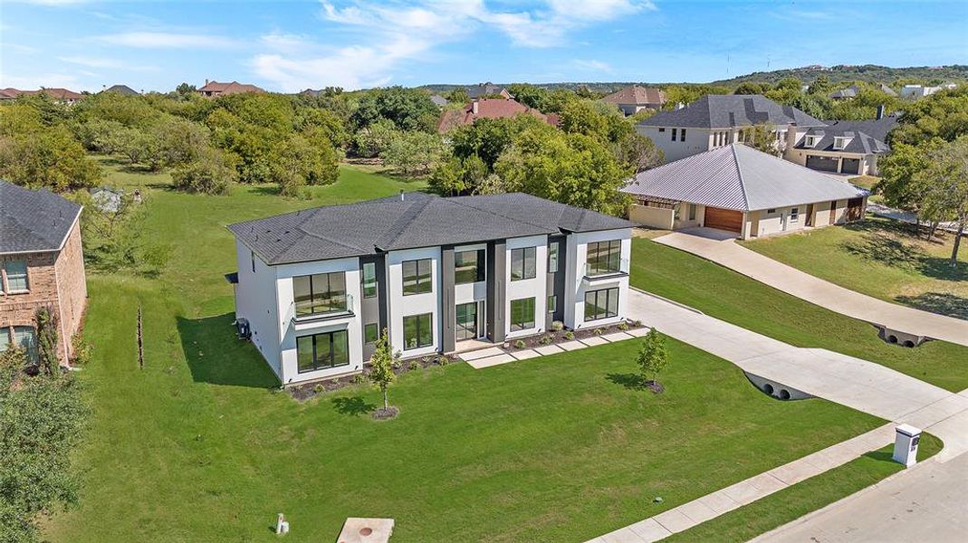 View of front of house featuring a garage and a front yard