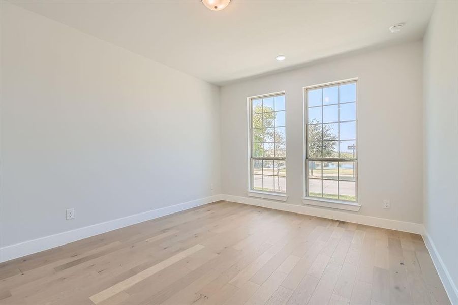 Empty room featuring light wood-type flooring