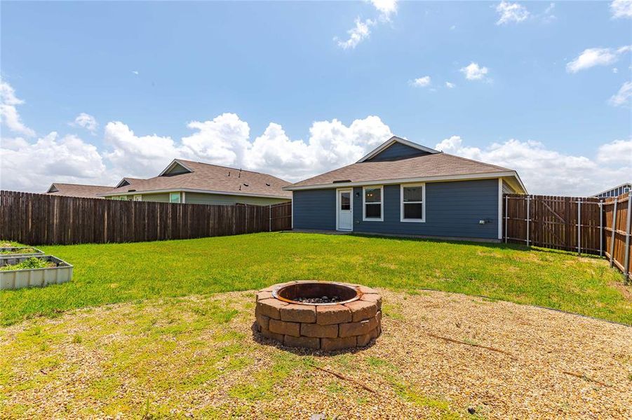 View of yard featuring a fire pit