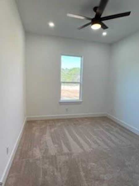 Unfurnished room with carpet floors and ceiling fan