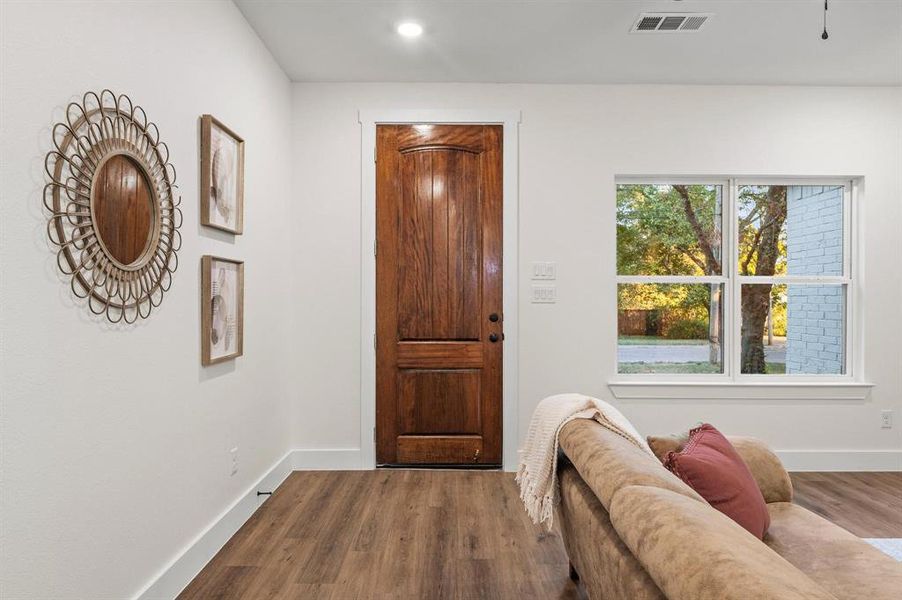 Foyer featuring wood-type flooring