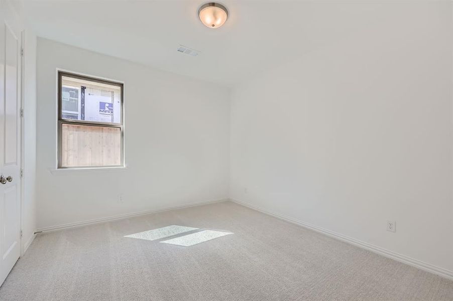 Empty room with light carpet