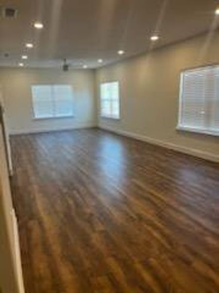 Spare room featuring dark hardwood / wood-style flooring