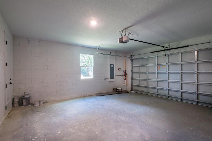 Garage with door to back yard and window