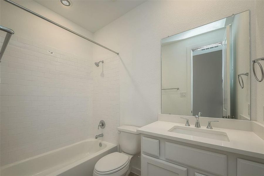 Full secondary bathroom, includes shower-tub combo. Shared by the previous secondary bedrooms.