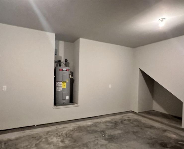 Hot water heater in the garage for easy access + a storage cubbie