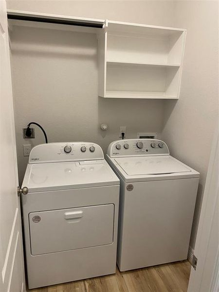Large inside laundry with new machines.