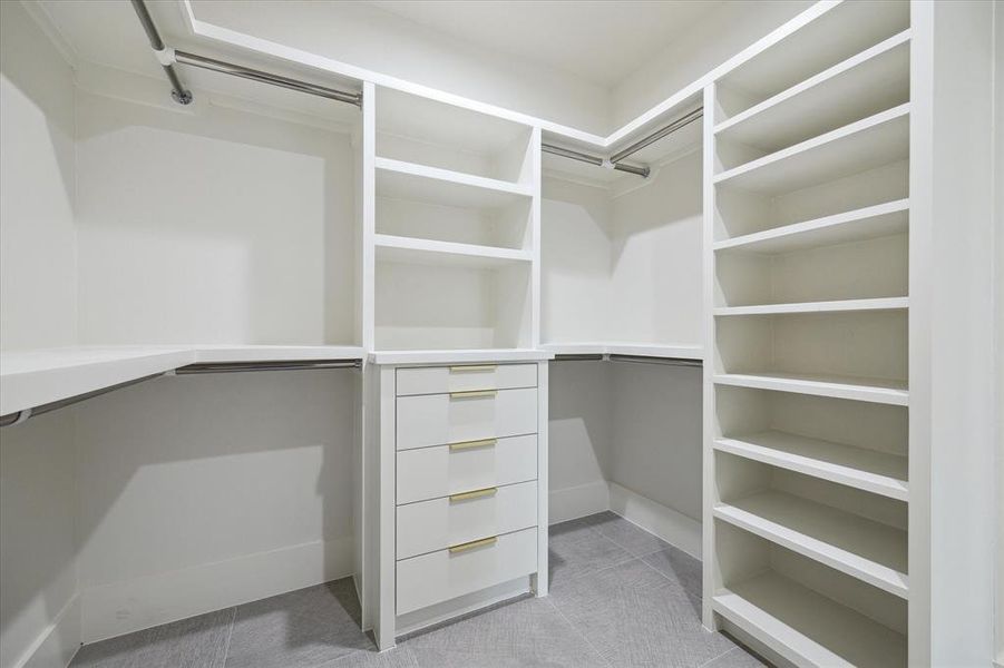Expansive walk-in closet offers ample storage space and organization solutions.