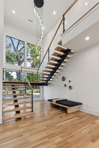 The beautiful floating stair is an architectural focal point that makes a statement both  inside the house and from the street.