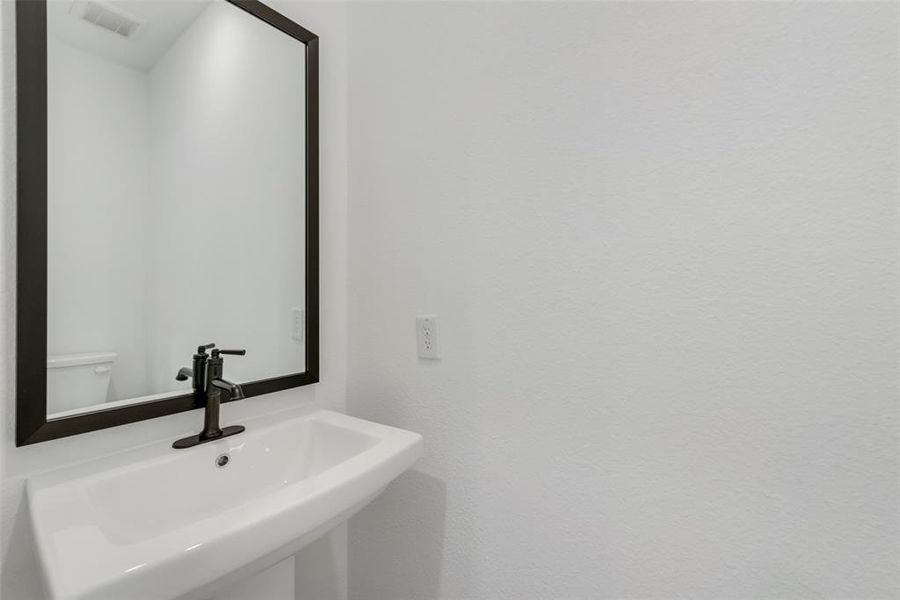 Bathroom featuring toilet and sink