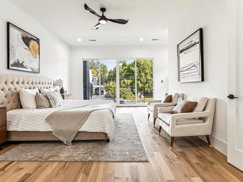 Bedroom with ceiling fan, light hardwood / wood-style floors, and access to outside