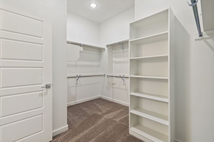 Primary Closet in the Bowie home plan by Trophy Signature Homes – REPRESENTATIVE PHOTO