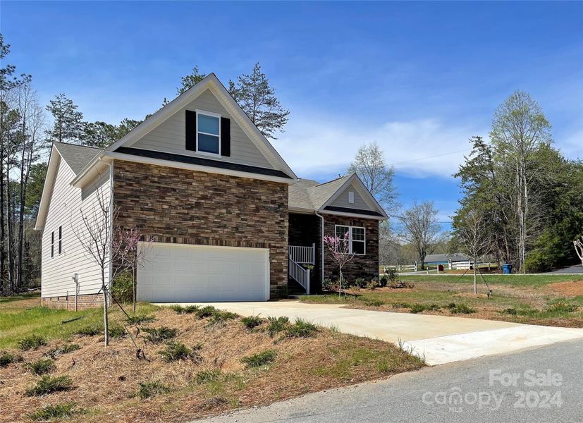 Hardboard and stone veneer exterior