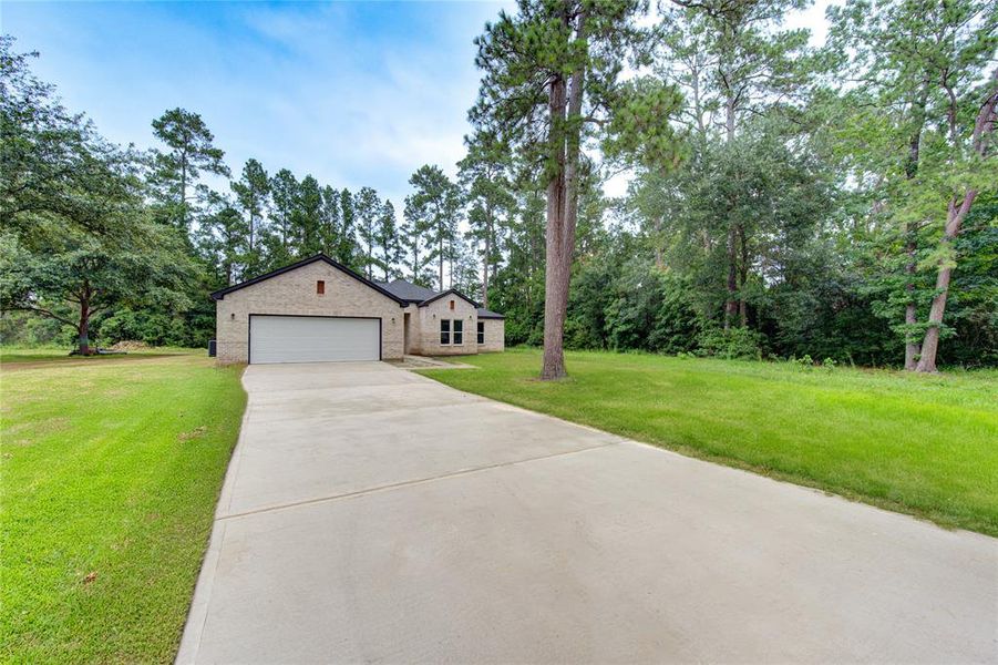 Welcome to your new home, loong driveway allows fr plenty of parking, grass is simulated