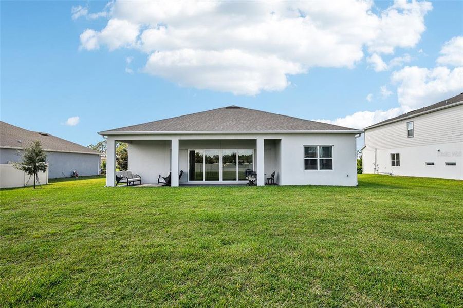 The COVERED PAVER LANAI and expansive backyard give you the perfect canvas to imagine and create the outdoor space of your dreams and you have VIEWS OF LAKE PICKETT from the front.