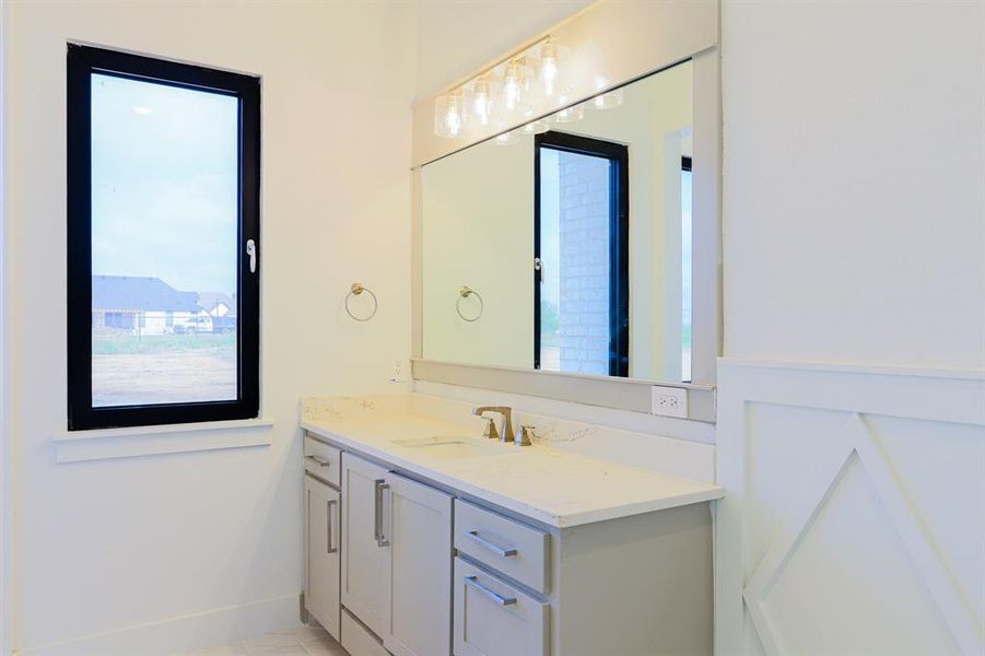 Bathroom featuring vanity and tile patterned flooring