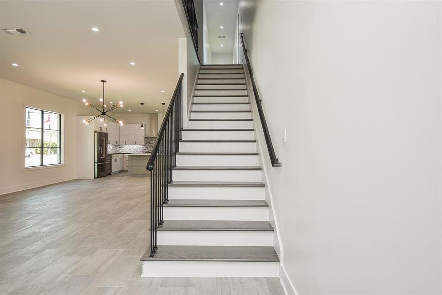 Custom iron handrail with 10ft ceilings on the first floor.