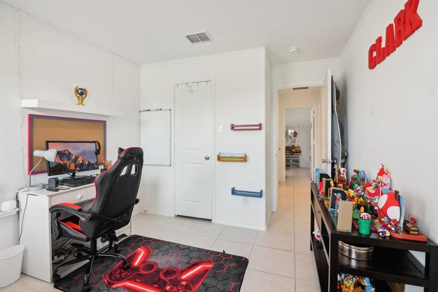 Office with light tile patterned flooring