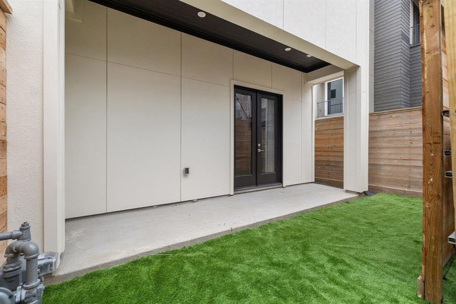 The ground floor double doors open to a lovely covered patio with lighting as well as a fully turfed backyard space.