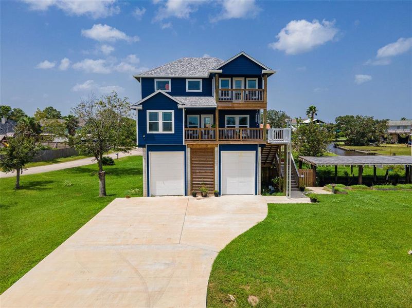 This custom-built gem is elevated 19 feet, showcasing impressive architectural design and modern appeal.