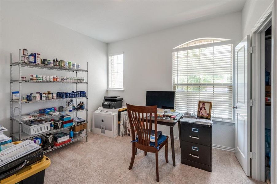 Office with light colored carpet