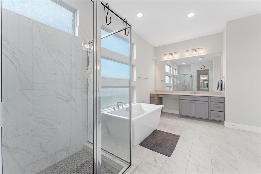 Modern finishes and sleek tile work complete the spa-like atmosphere, making this bathroom the ultimate place to unwind.