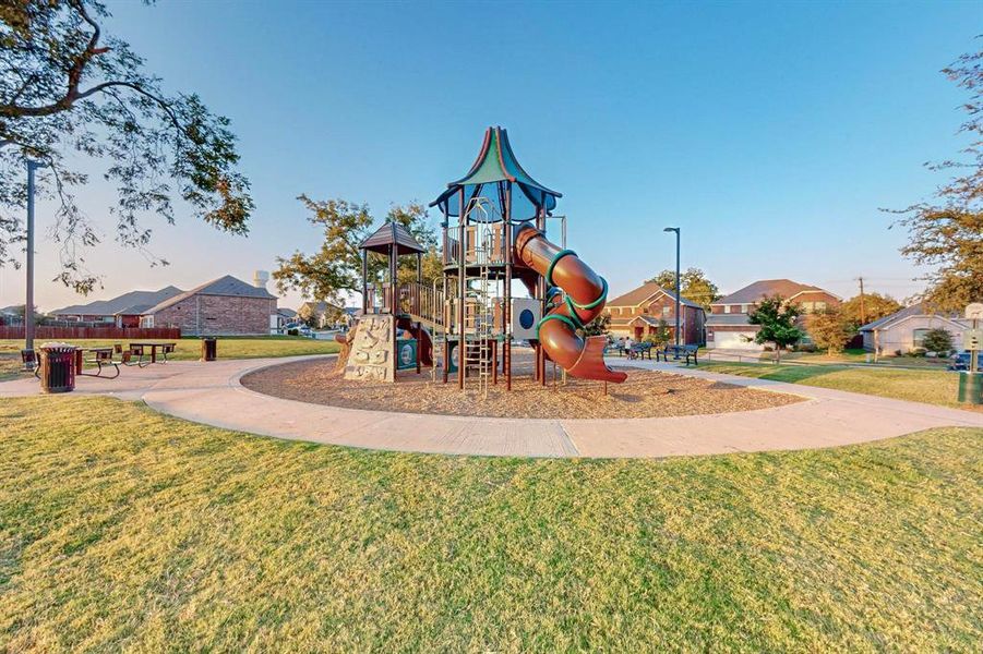 View of jungle gym with a lawn