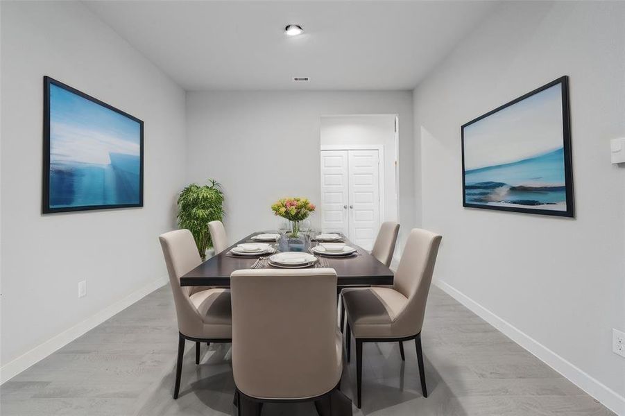 Make memories gathered around the table with your family and friends! This dining room features high ceilings and tile floors.