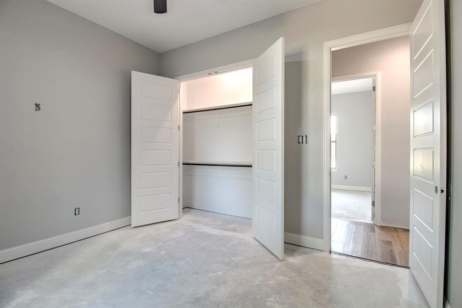 Unfurnished bedroom featuring a closet and ceiling fan