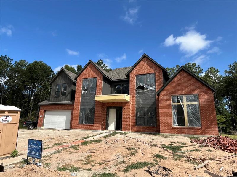 This home's brick will soon be painted white, similar to the rendering