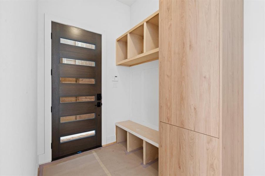 Mudroom with storage as you enter the home.