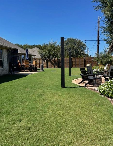 View of yard with a patio and a fire pit