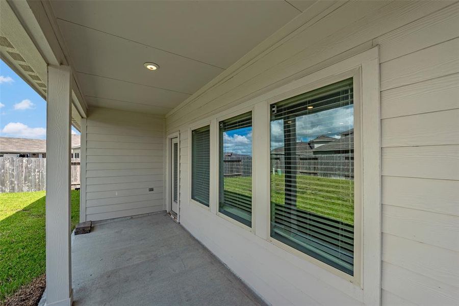 Enjoy your morning coffee or an evening beverage n this shaded patio.