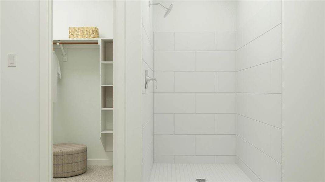 Bathroom featuring tiled shower