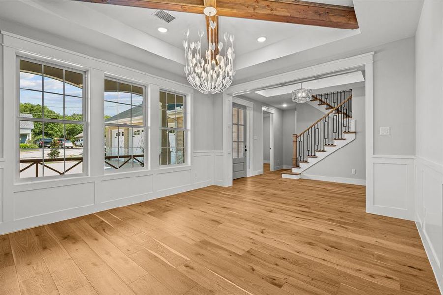 dining room w custom chandelier and timber beams