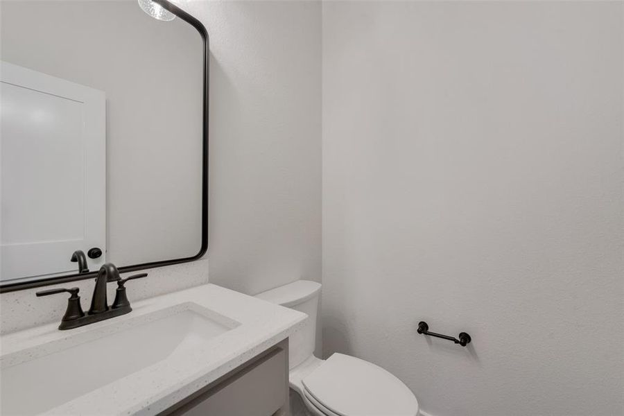 Bathroom featuring vanity and toilet