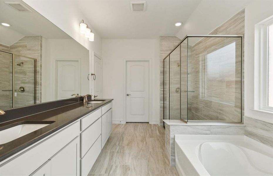 Owner's bath with dual vanity  *real home pictured